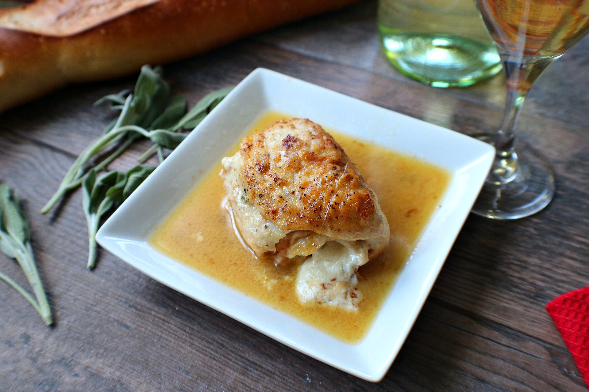 Rolled Chicken Saltimbocca in a white wine sauce